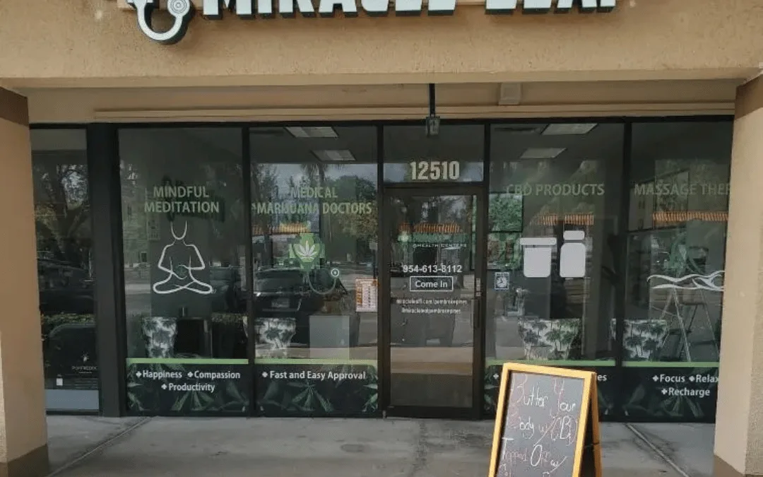 The Miracle Leaf® Health Centers clinic at 12510 Pines Blvd, Pembroke Pines: an illuminated sign above a glass frontage in a covered strip walkway, with the number 12510 on the door and a chalkboard sign outside.